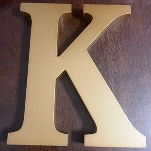 Wooden bronze colored letter K